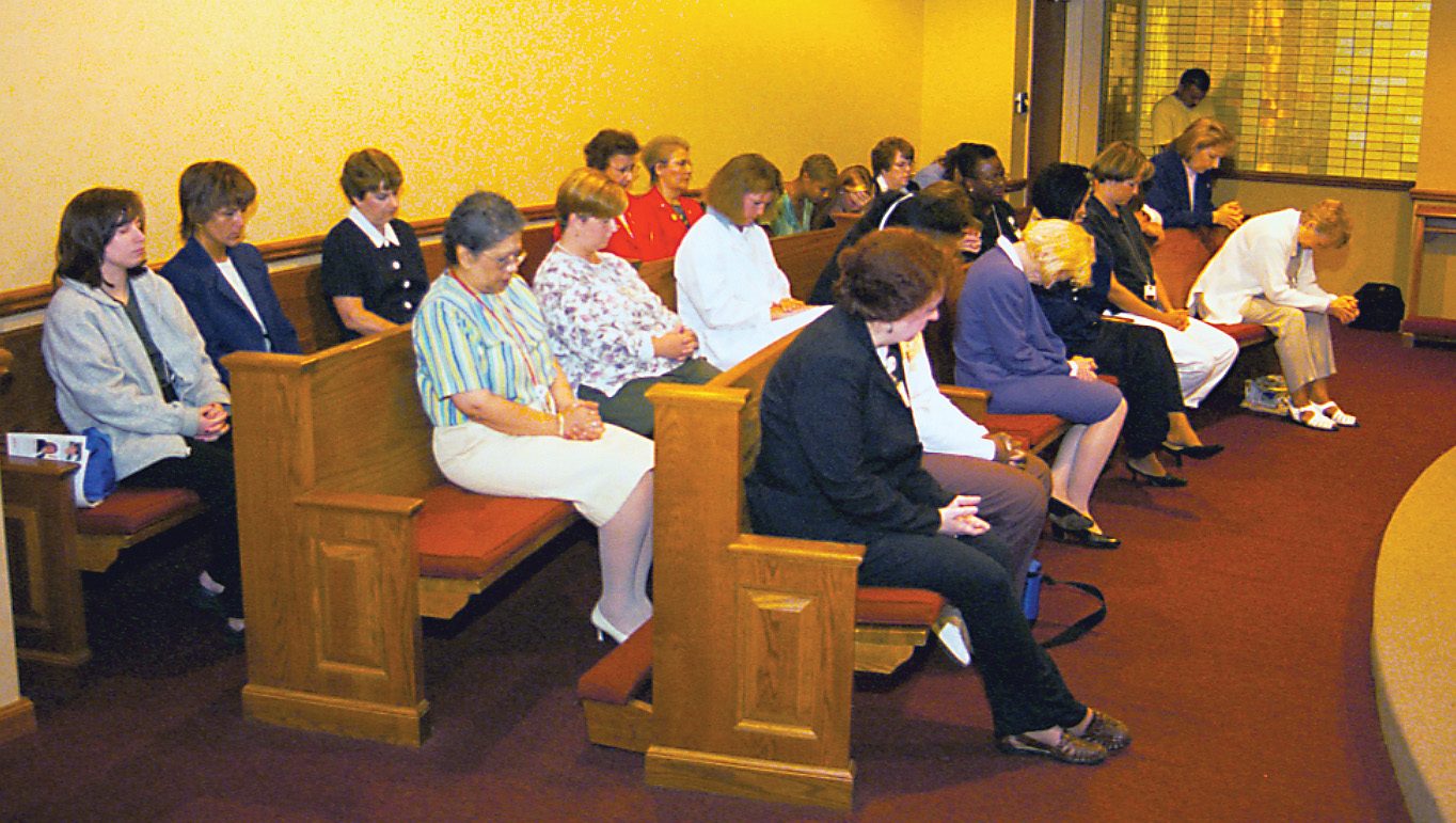 People praying in chapel